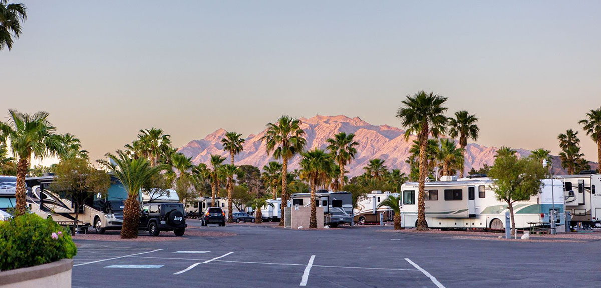 RVs parked against a mountainous horizon.