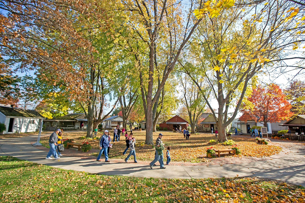 Tourists walking in front of historical buildings.