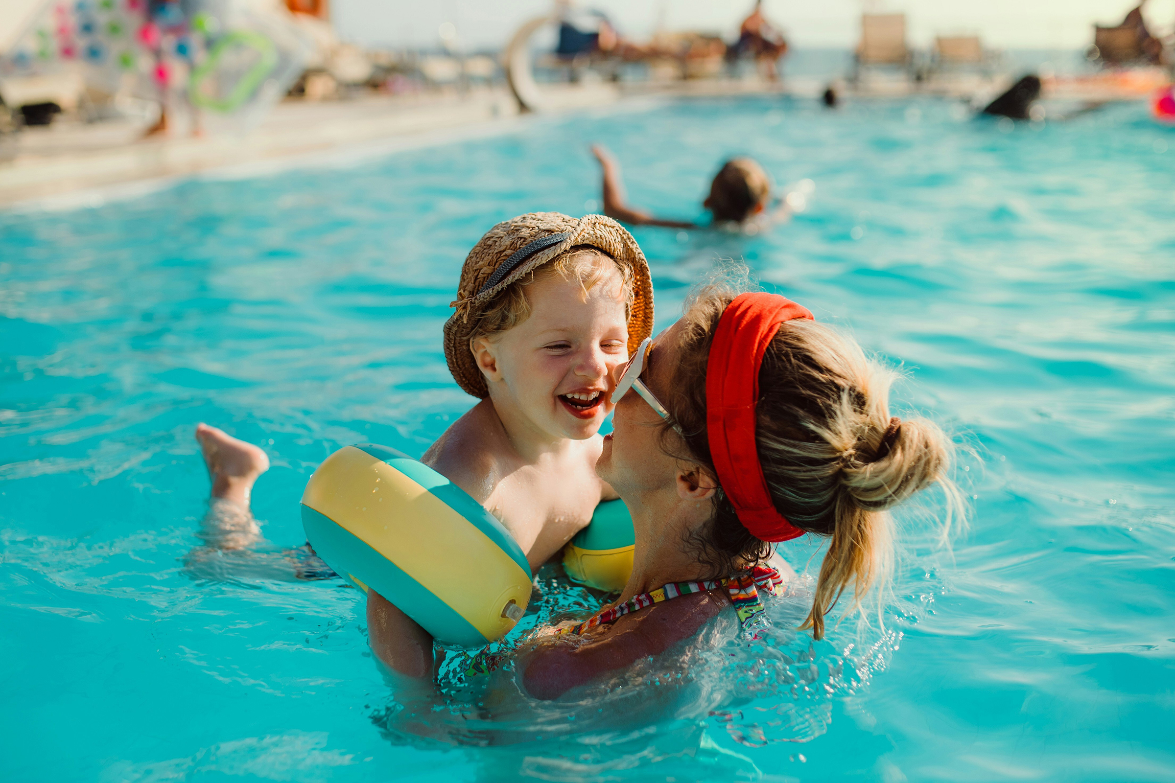 Woman with child in pool at RV resort