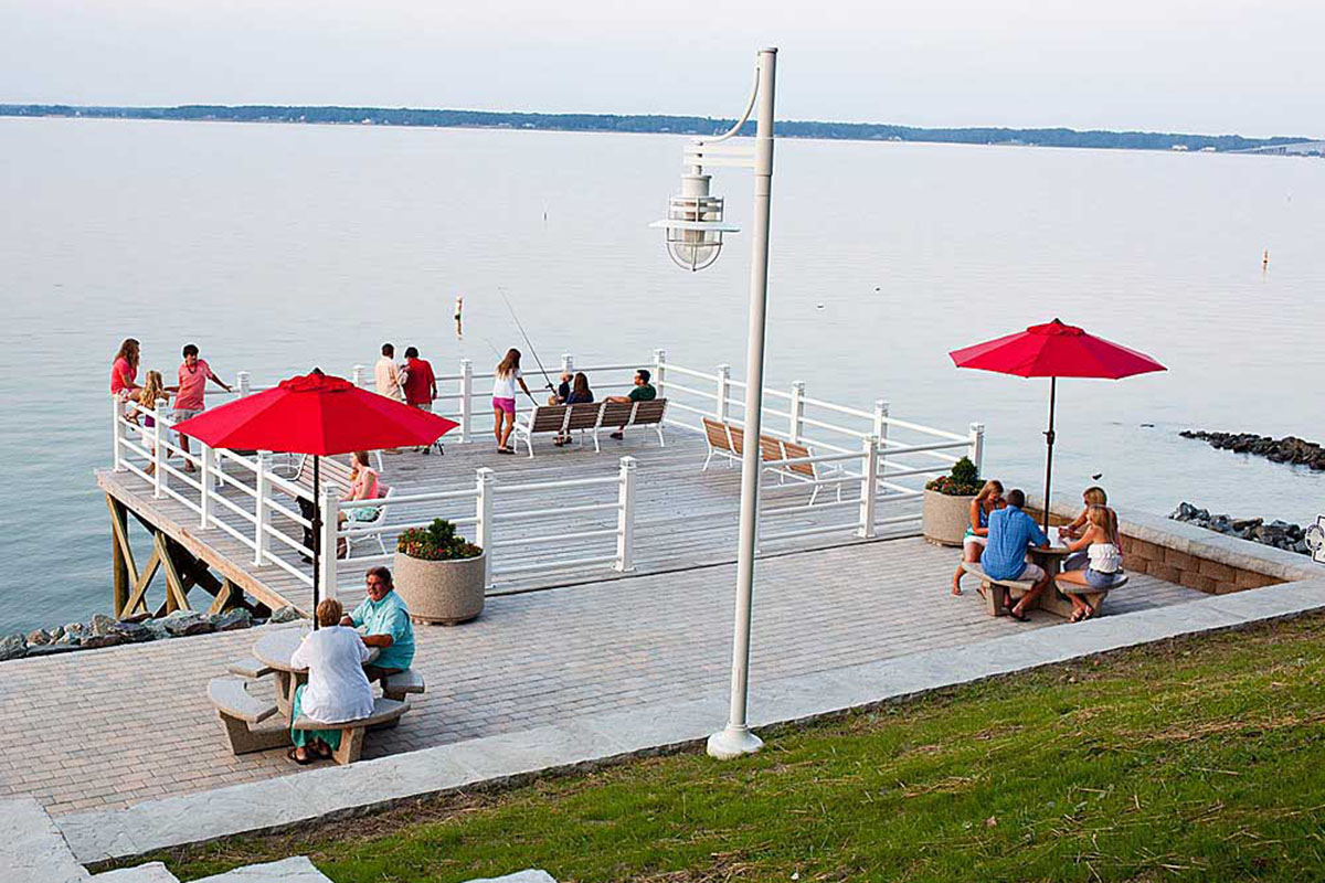 People gathered around a dock.