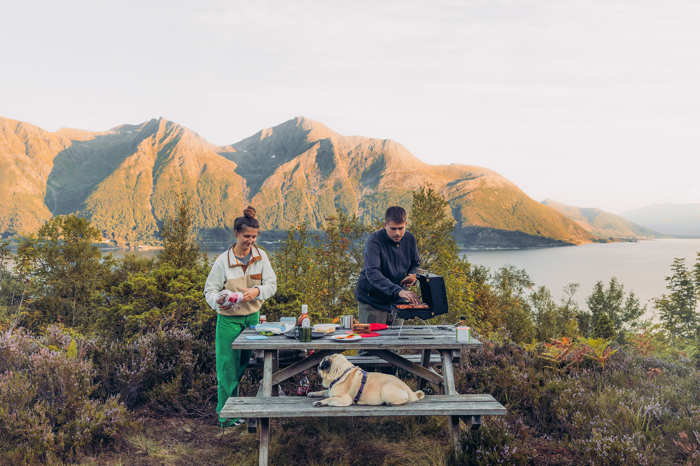 Family camping at lake with dog.