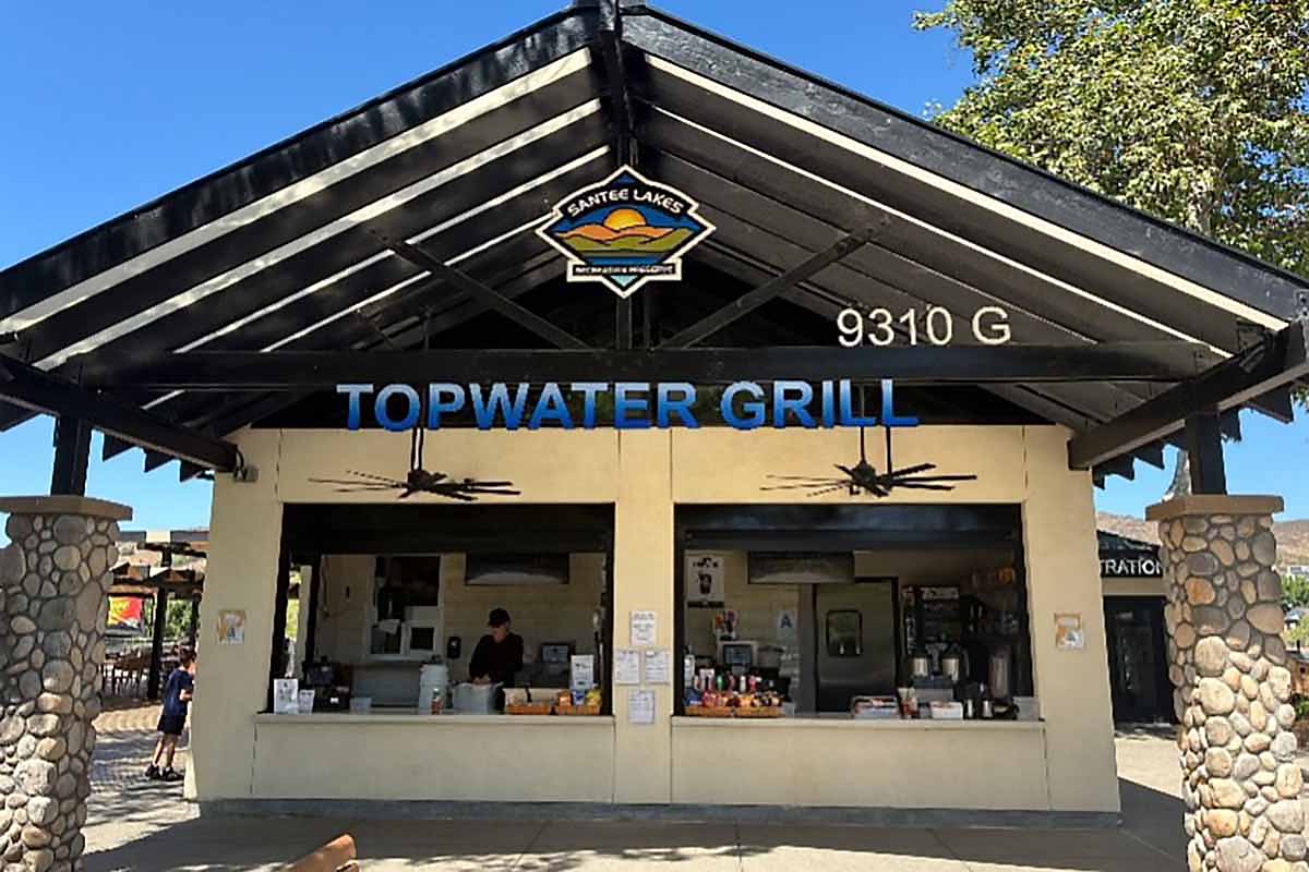 A snack bar with the sign, "Topwater Grill," open for business.