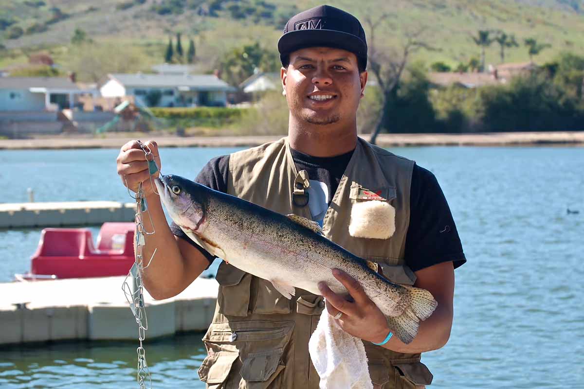 Smiling angler with big fish.