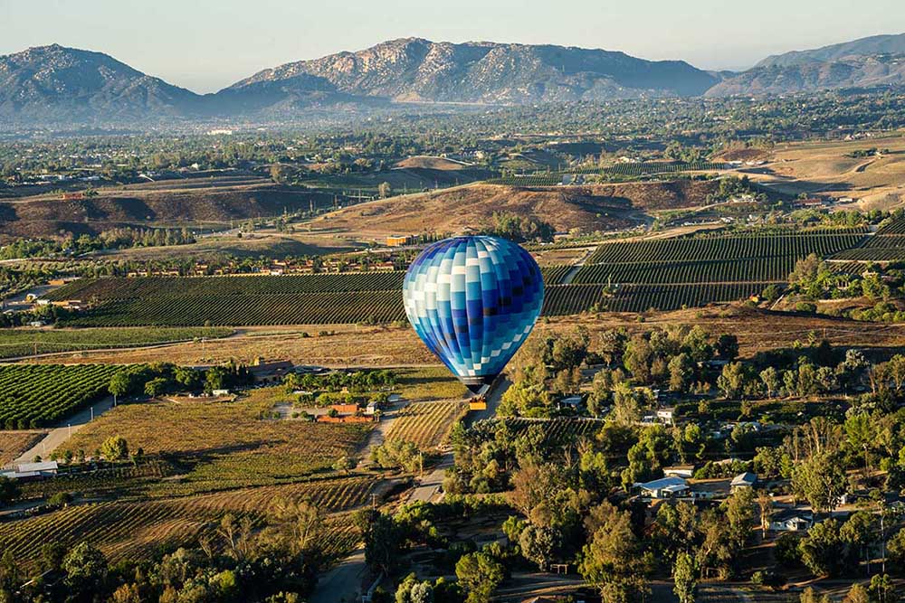Balloon over vineyards and farmlands.