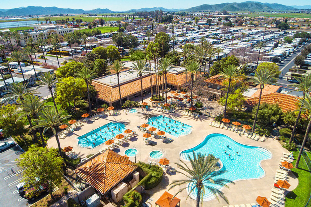 Aerial shot of three pools under palms trees.