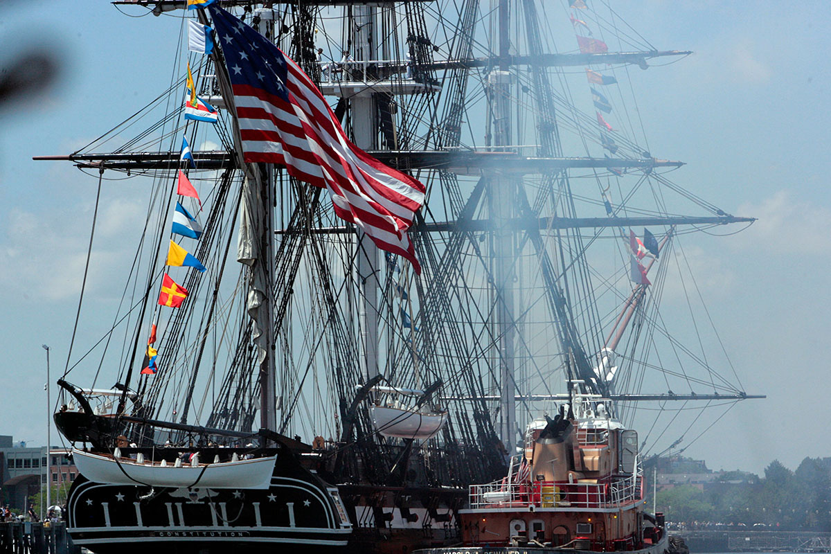 Tall ship with guns blazing.