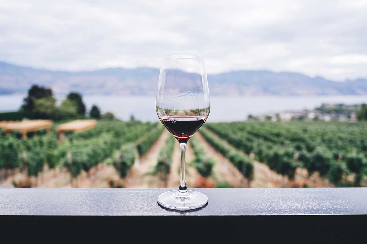 Wine glass balanced on a railing.