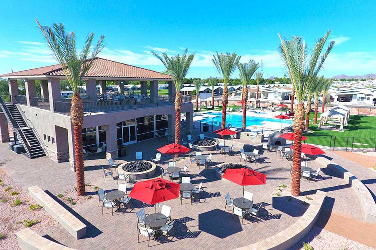 Two-story resort building surrounded by patio.