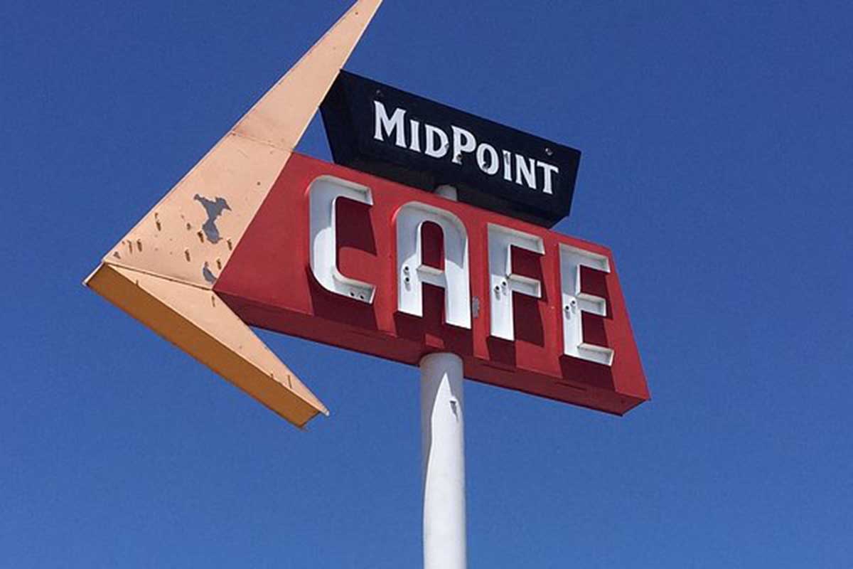 1950s style sign with neon lettering.