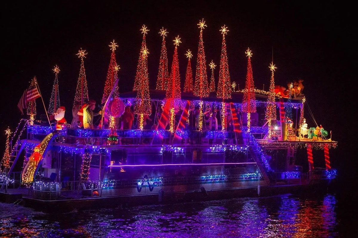 Boat bedecked with colorful holiday lights.