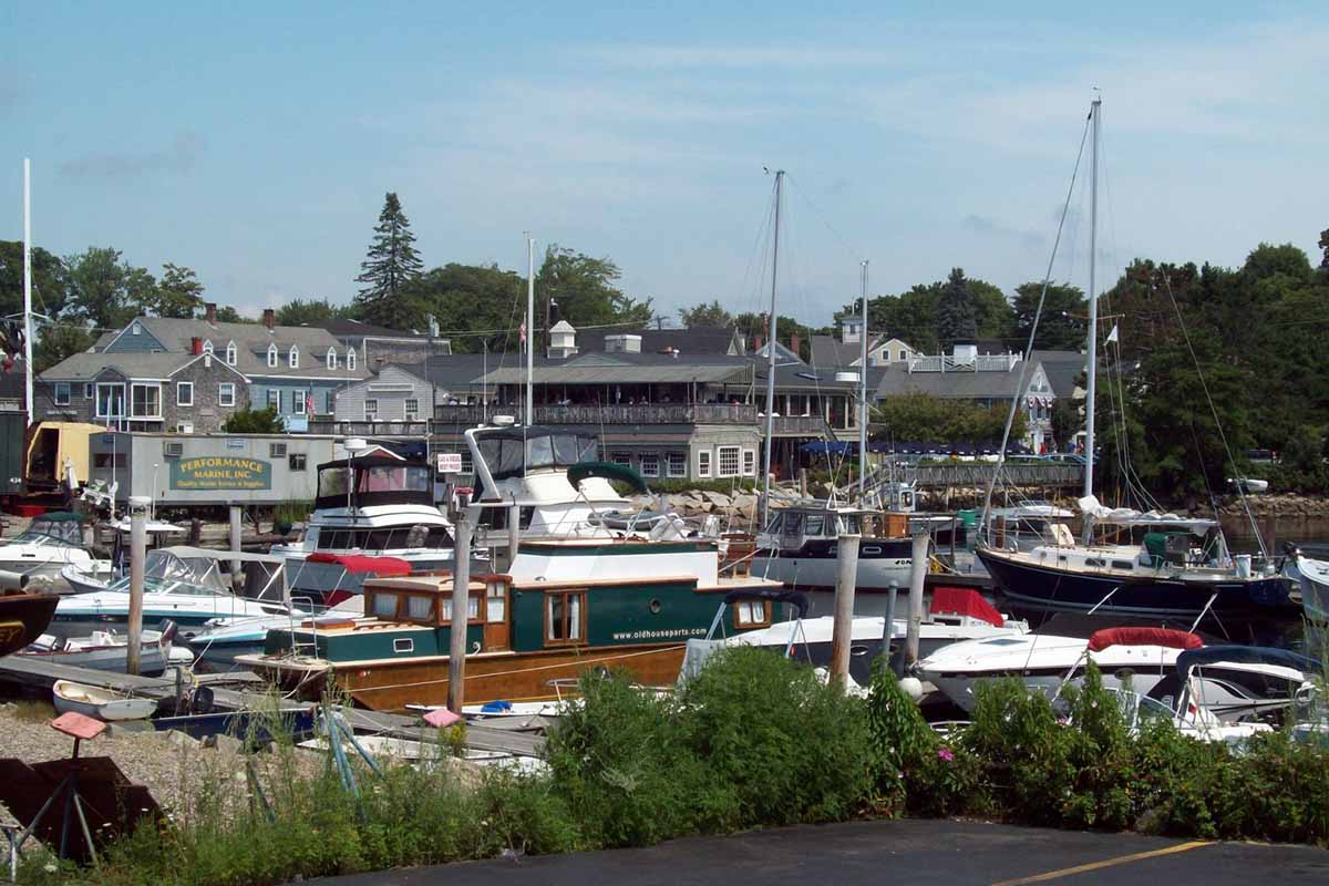 Boats moored in a bustling harbor.