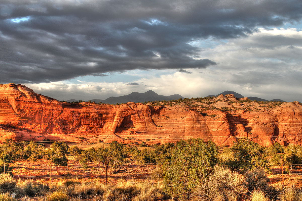 Sun hitting crimson bluffs.