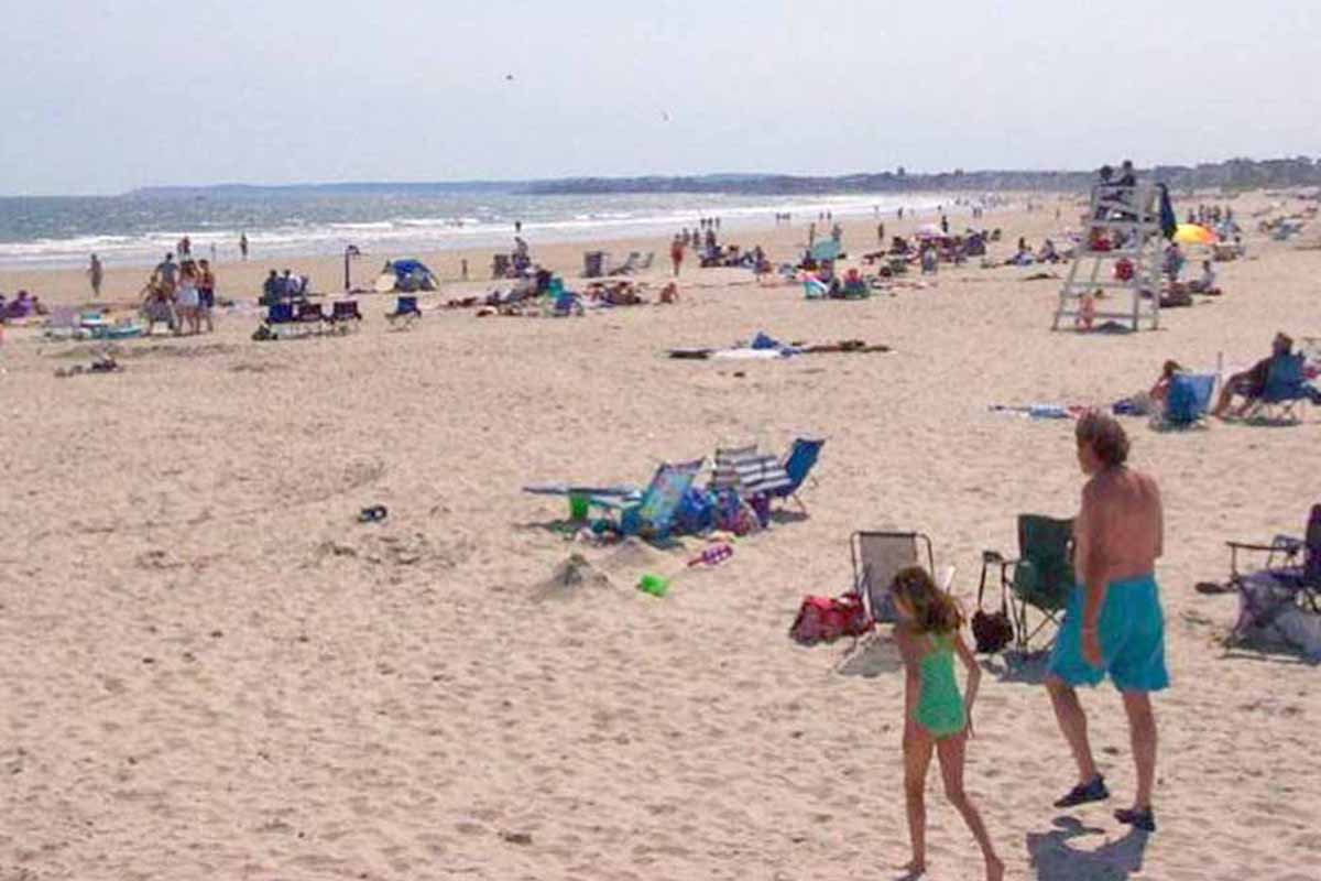 People relaxing on a beach.