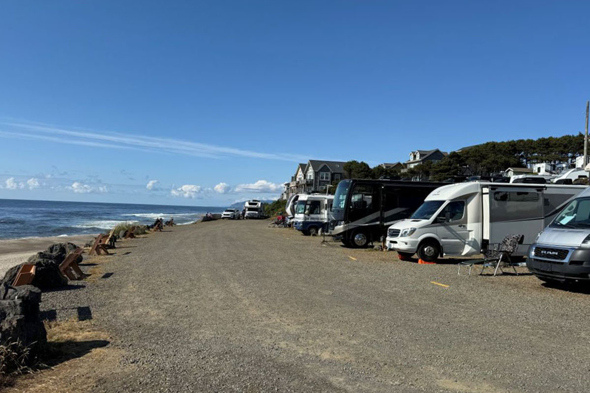 RVs parked on the ocean shore.