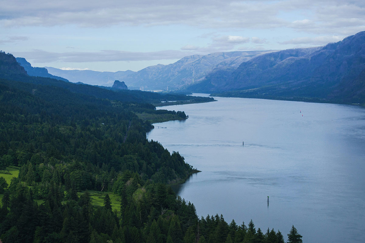 Wide river running through mountains.