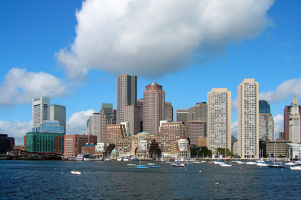 Tall buildings on the shoreline.