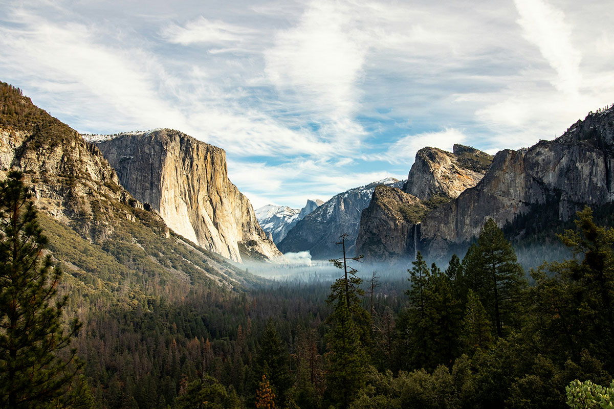 Image of majestic valley flanked by rock walls.