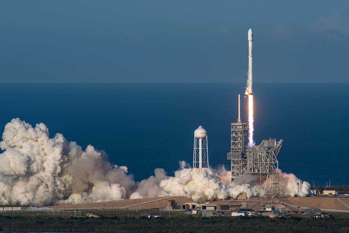 Rocket ascending from launch pad.