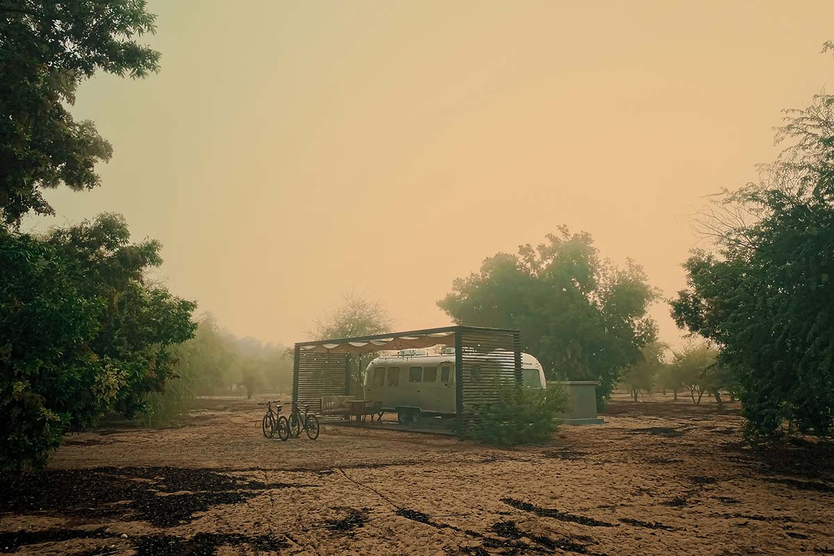 Airstream trailer parked in the haze.
