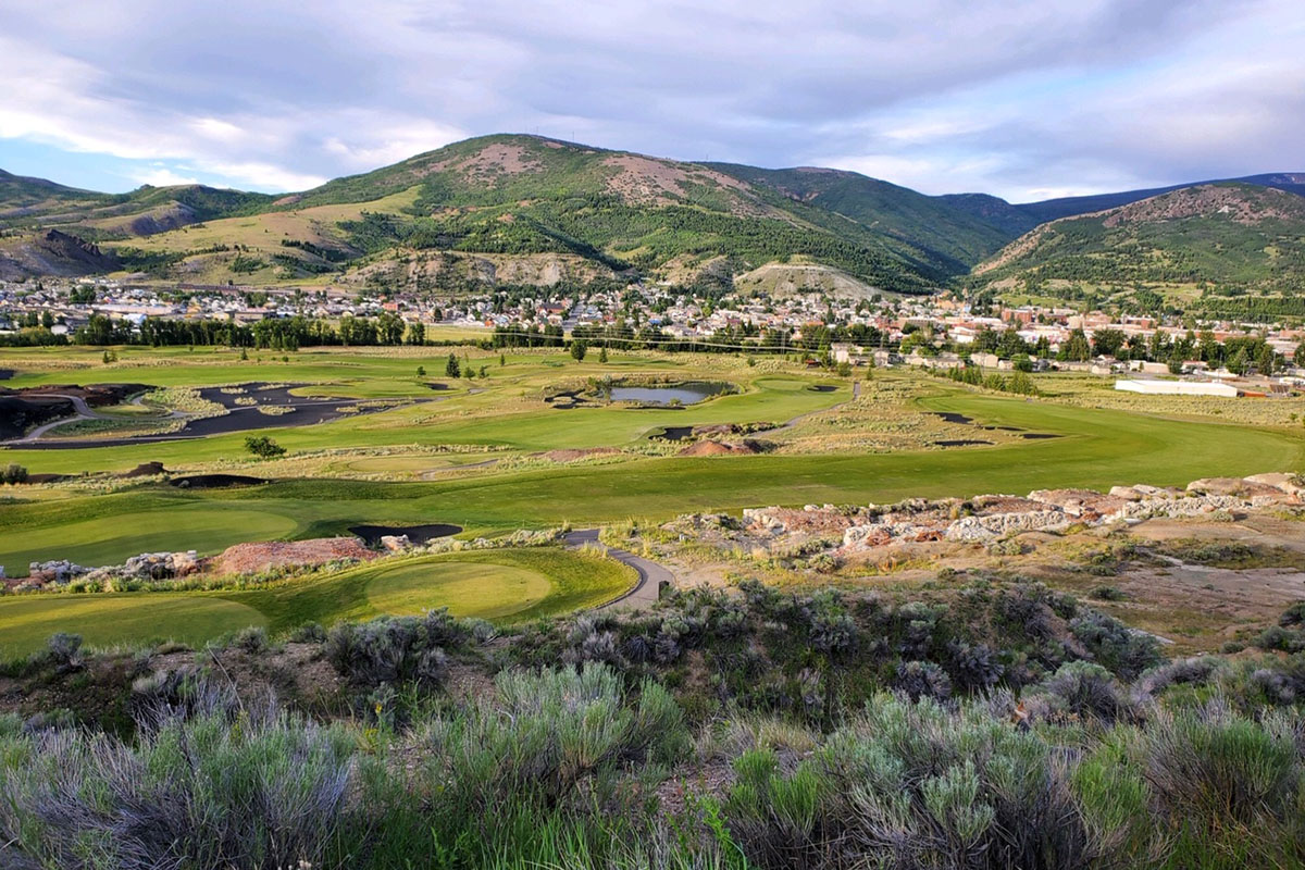 Golf course with mountains in background