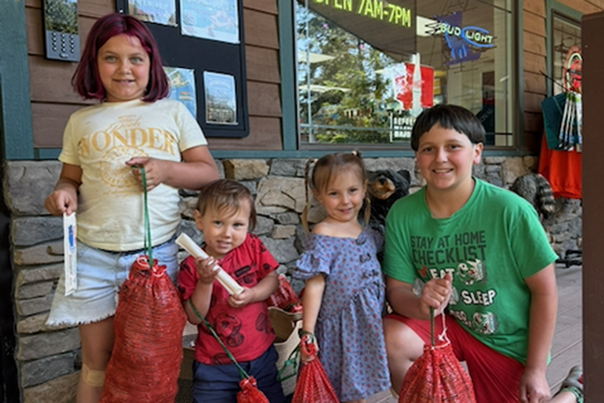 Kids with fishes.