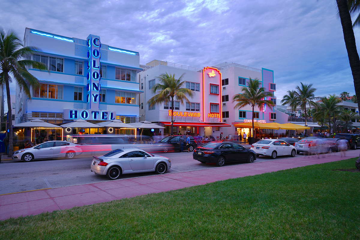 Neon lights illuminate classic buildings