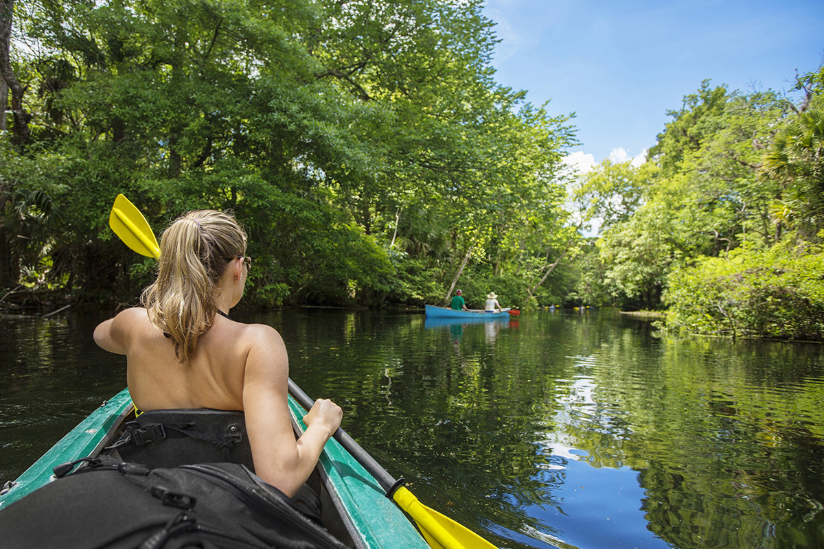 Kayaking down a jungle river.